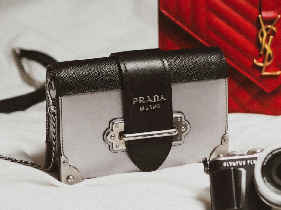 black and silver camera on white textile